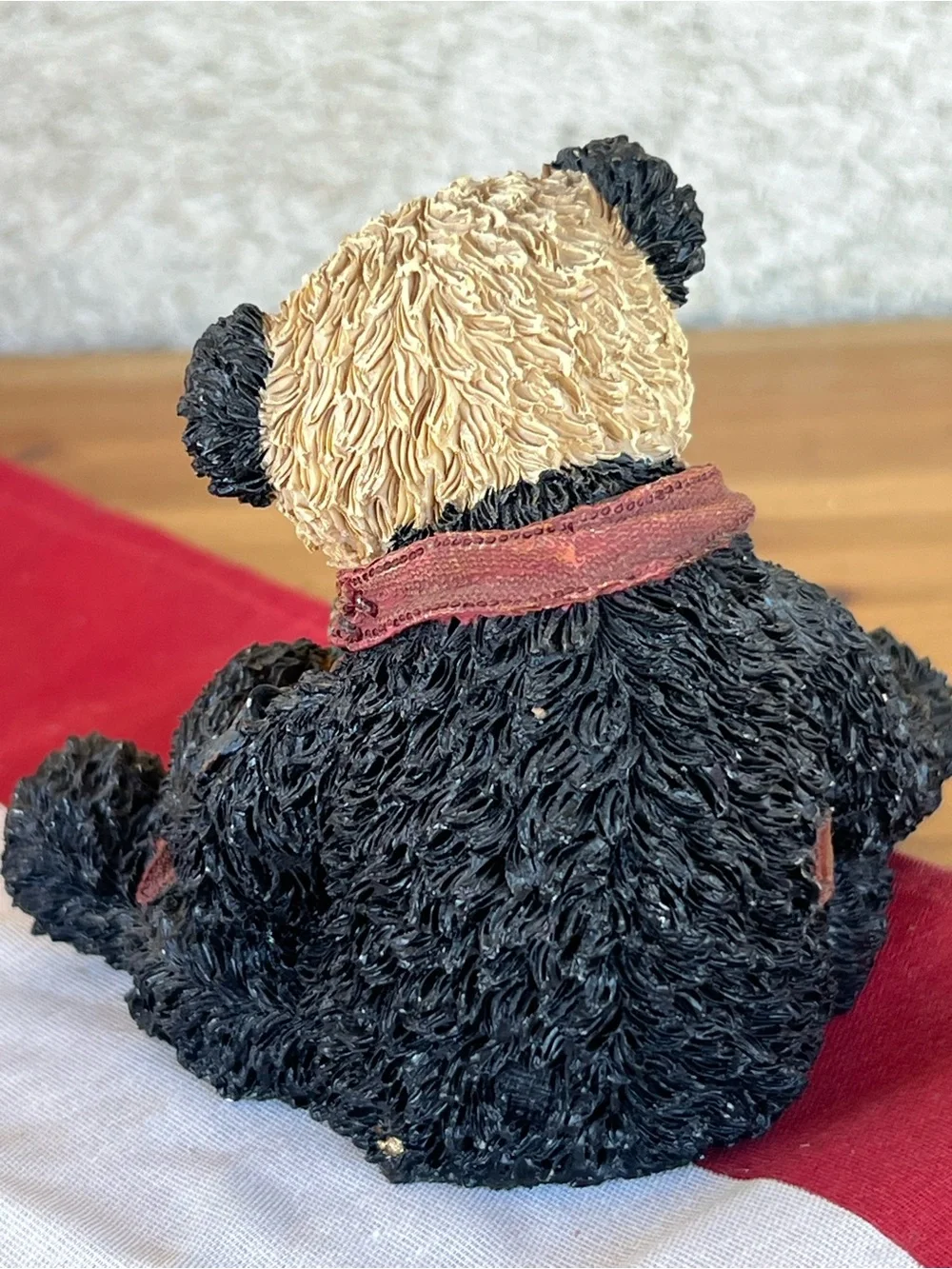 Adorable Black and Beige Panda Figurine with Burgundy Bow and Decorative Blocks